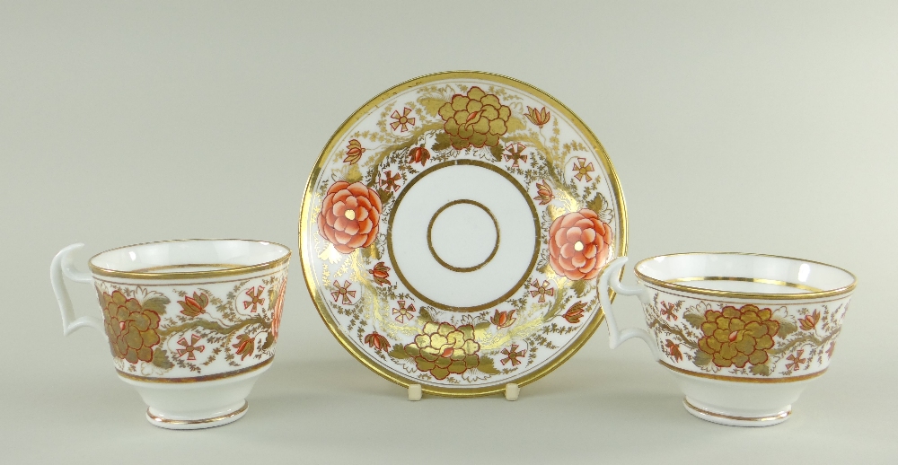 A SWANSEA PORCELAIN JAPAN PATTERN TRIO the two cups with curvaceous ogee handles, decorated with a