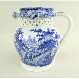 A GLAMORGAN EARTHENWARE PUZZLE JUG IN THE 'PULTENEY BRIDGE' TRANSFER PATTERN of bellied form with