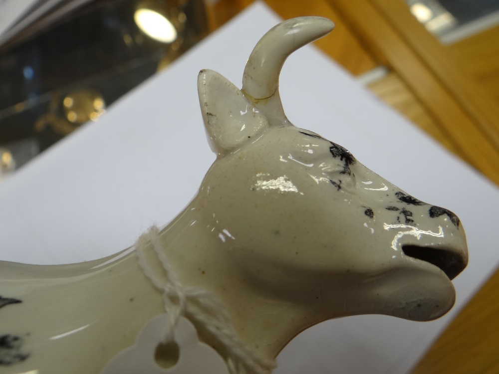 A GLAMORGAN POTTERY COW CREAMER with tail as loop handle, standing on a naturalistic oval base, - Image 17 of 21