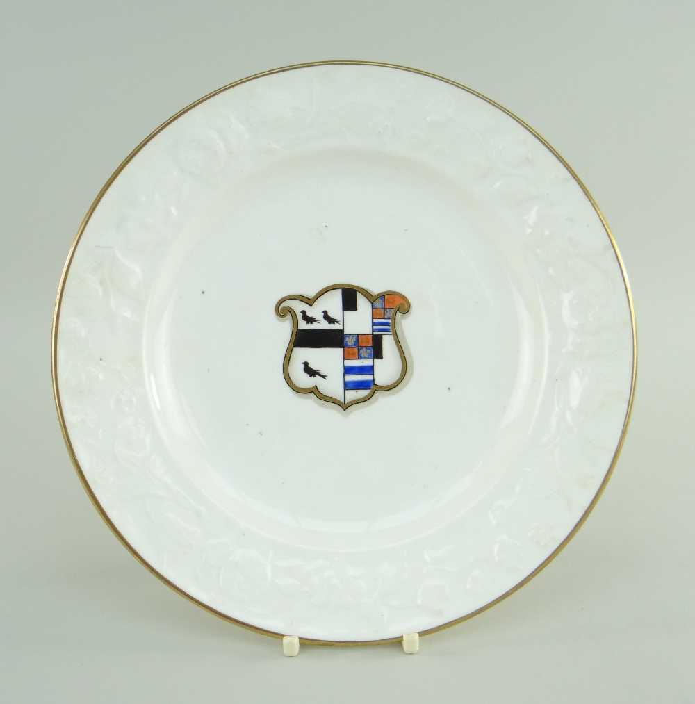 SWANSEA PORCELAIN PLATE having moulded floral borders, gilt rims and centred painted and gilded