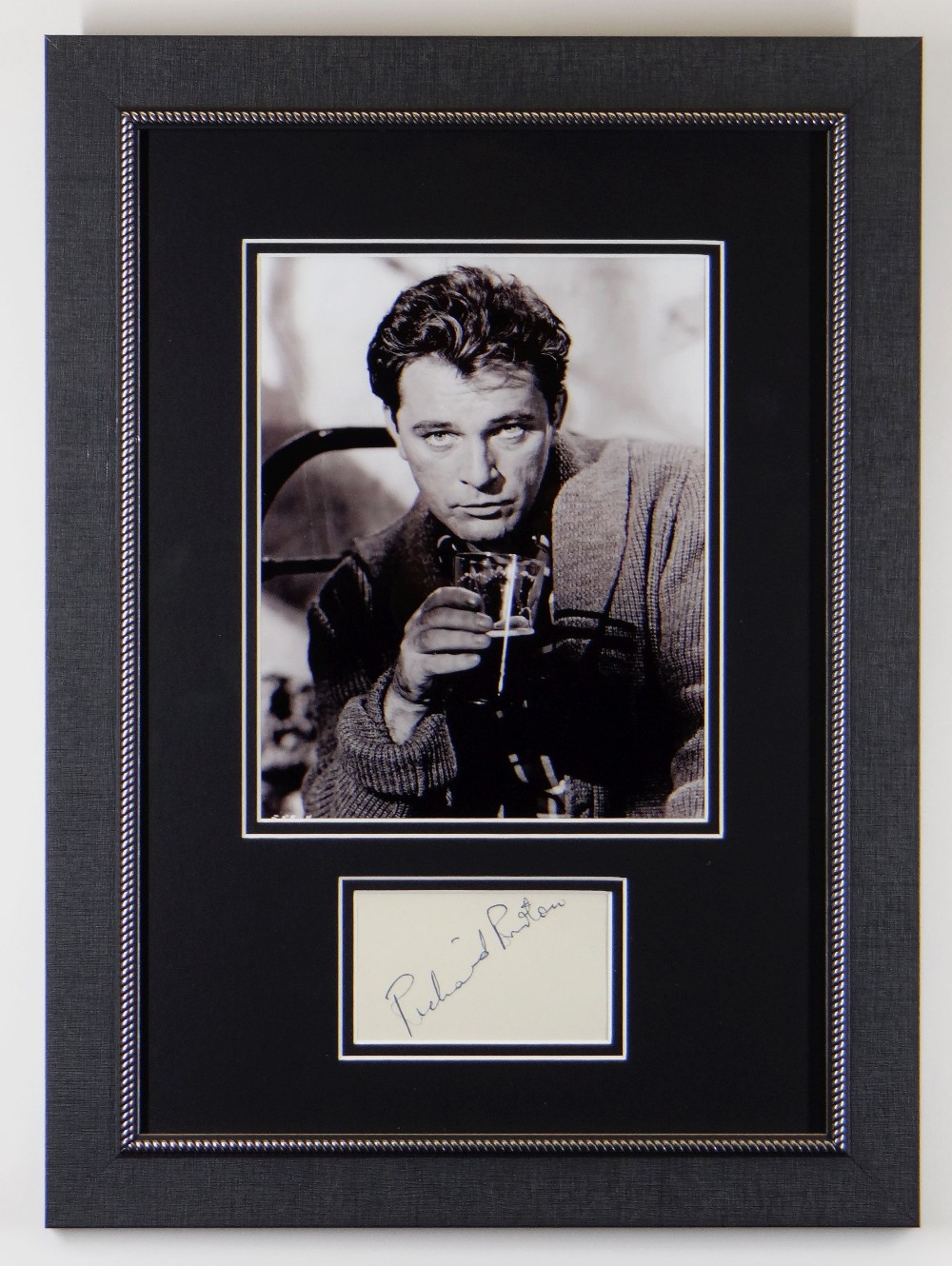 RICHARD BURTON AUTOGRAPH signed diagonally in pen on paper, presented in a modern frame with a