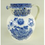 A GLAMORGAN EARTHENWARE PUZZLE JUG IN THE CHRYSANTHEMUM TRANSFER PATTERN of bellied form with loop