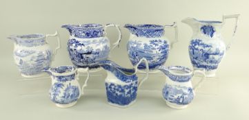 SEVEN VARIOUS SWANSEA POTTERY BLUE & WHITE TRANSFER JUGS comprising (1) 'Drover' example with