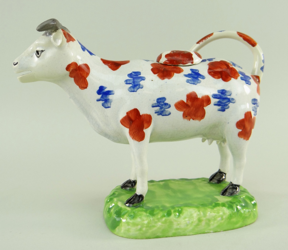 A SWANSEA CAMBRIAN POTTERY COW CREAMER with tail as loop handle, standing on a moulded oval base, - Image 2 of 2