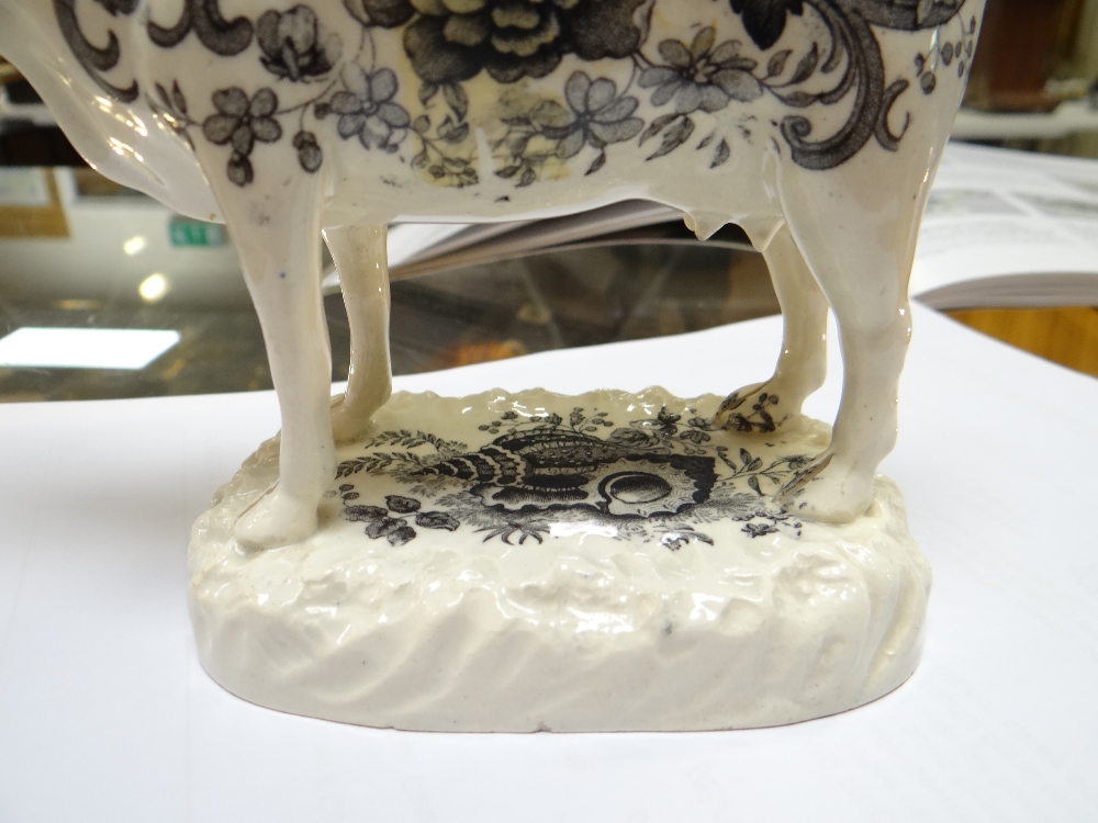 A GLAMORGAN POTTERY COW CREAMER with tail as loop handle, standing on a naturalistic oval base, - Image 14 of 21