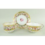 A SWANSEA PORCELAIN TRIO painted with circling anemone to a gold band reserve, the interior with