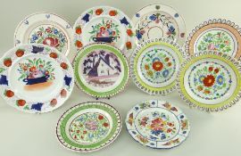 GROUP OF SWANSEA POTTERY COLOURFULLY HAND-PAINTED PLATES including five ribbon plates with moulded