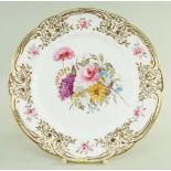 A SMALL NANTGARW PORCELAIN PLATE of lobed circular form, the border moulded with c-scrolls,