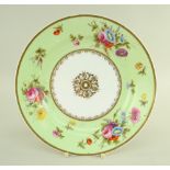 A SWANSEA PORCELAIN PLATE WITH LIME GREEN RESERVE BORDER painted with sprays of flowers and