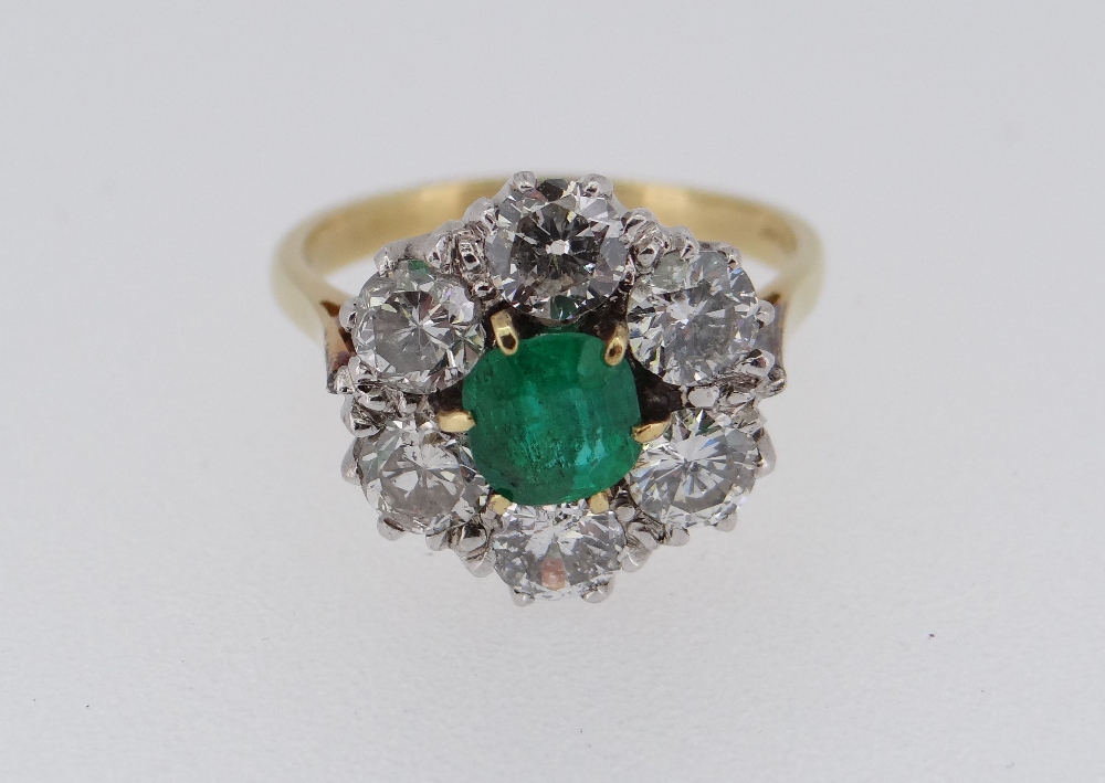 18CT GOLD EMERALD & DIAMOND CLUSTER RING, the central emerald (0.5 x 0.5cms) surrounded by six - Image 2 of 4