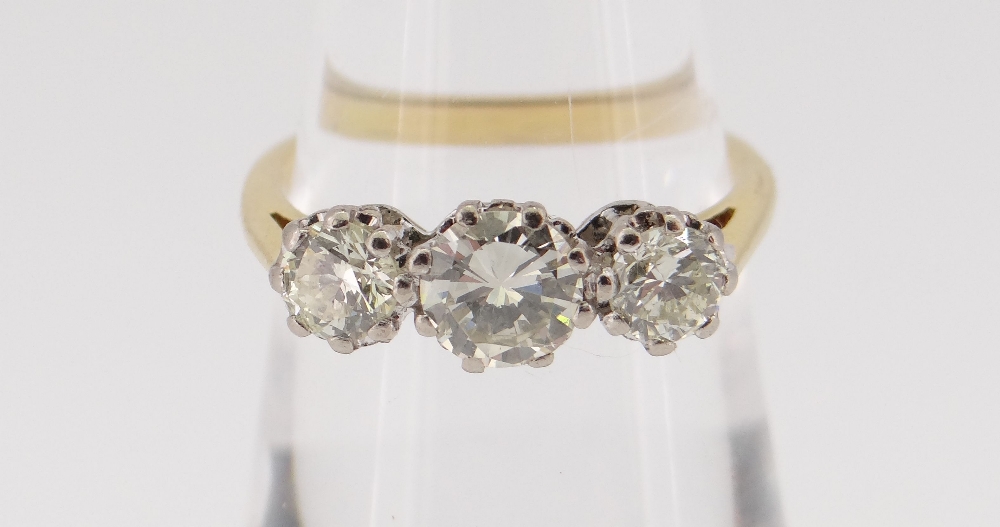 18CT GOLD THREE STONE DIAMOND RING, the three claw set stones totalling 1.0cts approximately (visual