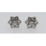 PAIR OF WHITE METAL SEVEN-STONE DIAMOND CLUSTER EARRINGS, each stone 0.07ct approximately (visual