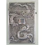 CHINESE SILVER CARD CASE, makers mark 'NM' c. 1900, embossed in high relief with a four-clawed