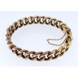 15CT GOLD FIXED CURB LINK BRACELET WITH SAFETY CHAIN, 25.6gms, stamped '15' to the clasp, 6.75cms