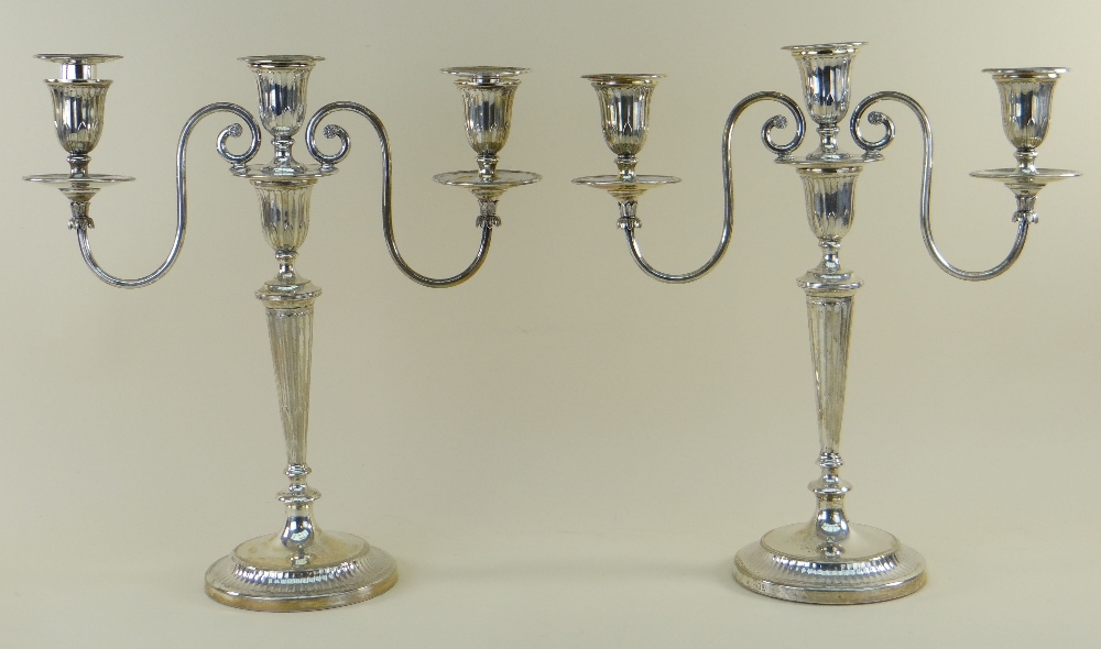 PAIR GEORGE V SILVER THREE-LIGHT CANDELABRA, Thomas Bradbury and Sons, London 1917, with reeded drip