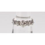 WHITE METAL FIVE STONE DIAMOND RING, the claw set graduating stones totalling 1.0cts