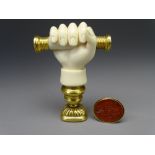 VICTORIAN DESK & FOB SEALS, the desk seal of carved ivory in the form of a hand gripping a baton,