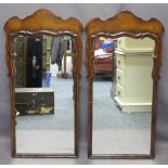 ANTIQUE STYLE REPRODUCTION WALNUT WALL MIRRORS, a pair, with shaped top detail, 93cms H, 47cms max