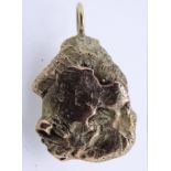 A ROUGH YELLOW METAL & GOLD NUGGET PENDANT, marks to the gold indistinct, 24.8grms