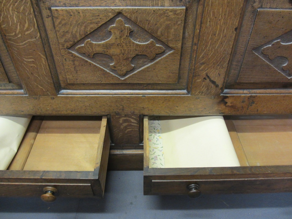 CIRCA 1800 CARVED OAK PRESS CUPBOARD with fan detail and Gothic type crosses on shaped and chamfered - Image 7 of 7