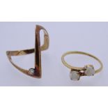 TWO 9CT GOLD DRESS RINGS to include a single diamond set wishbone, size P, the other semi-