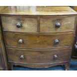 VICTORIAN MAHOGANY BOW FRONT CHEST of two short over two long drawers with turned wooden knobs on