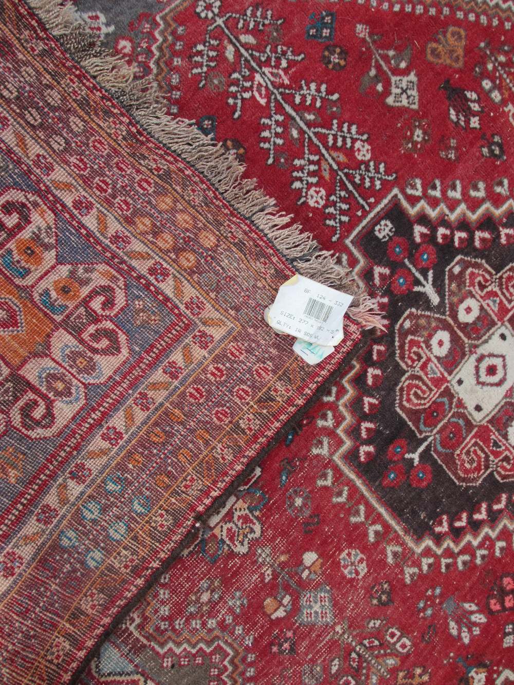 EASTERN WOOLLEN CARPET red ground with traditional central block pattern and multi-bordered - Image 2 of 2