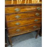 REGENCY MAHOGANY FOUR DRAWER CHEST on corner tapering supports with spade feet, the oak lined