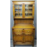 REPRODUCTION OAK GLASS TOP DRESSER having twin six pane glazed doors with interior shelves and brass