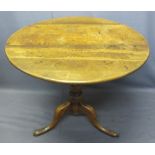 CIRCULAR TOP OAK TILT-TOP TRIPOD TABLE, early 19th Century, the 85cms diameter top on a turned