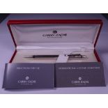 CARAN D'ACHE ECRIDOR BALLPOINT PEN - Rhodium plated with 'Retro' engraved barrel. Push button