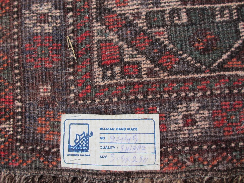 IRANIAN SHIRAZ CARPET tonal reds and blues with busy overall pattern and central block showing - Image 2 of 2