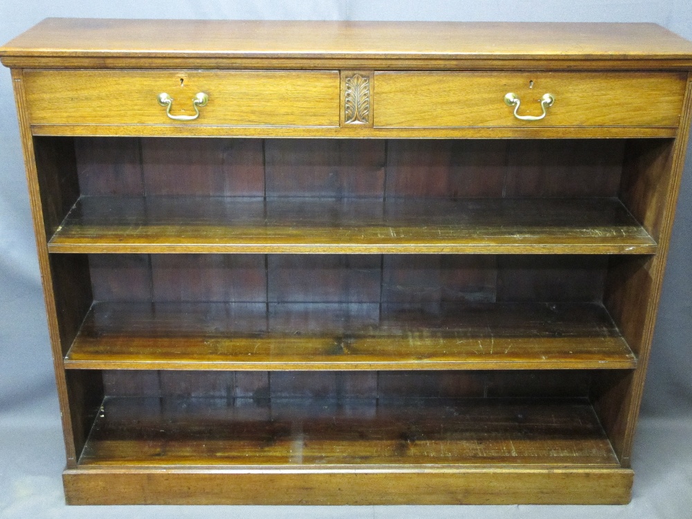 MAHOGANY STANDING BOOKCASE with two upper drawers and carved front detail on a plinth base, 105.5cms