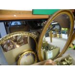 TWO GILT FRAMED CIRCULAR & AN OAK EFFECT OVAL WALL MIRROR, various measurements