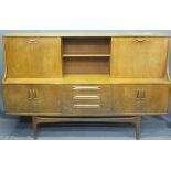 G-PLAN OR SIMILAR MID-CENTURY SIDEBOARD with upper section sliding and drop down doors, 121cms H,