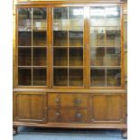 EARLY 20TH CENTURY MAHOGANY BOOKCASE, the closed top inverted cornice over three eight pane glazed