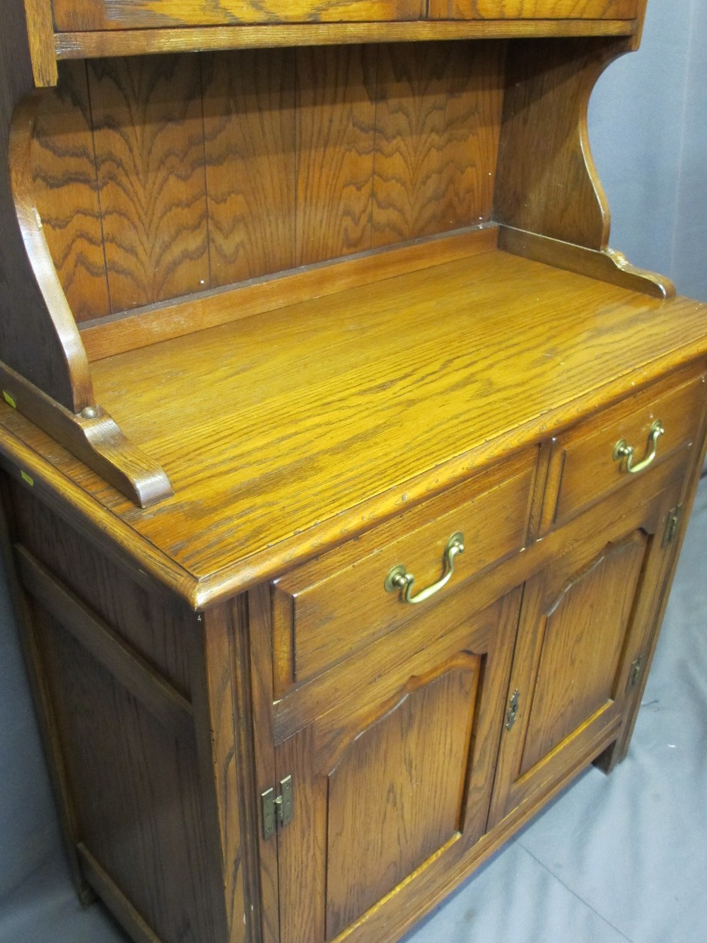 REPRODUCTION OAK GLASS TOP DRESSER having twin six pane glazed doors with interior shelves and brass - Image 2 of 2