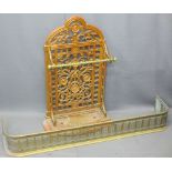 VICTORIAN CAST IRON STICK STAND and a brass fender, the stand with pierced floral detail, brass