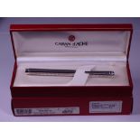 CARAN D'ACHE ECRIDOR FOUNTAIN PEN - Rhodium plated with 'Chevron' engraved barrel and cap. Rhodium