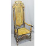 CHARLES II STYLE WALNUT HIGHBACK HALL CHAIR with carved crest rail above a cane back and seat with