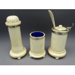 LATE 19TH CENTURY IVORY & WHITE METAL MOUNTED THREE PIECE CONDIMENT SET, cylindrical form on ball