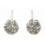 A pair of cluster stud earrings in an 18 k. white gold setting and brilliant cut diamonds