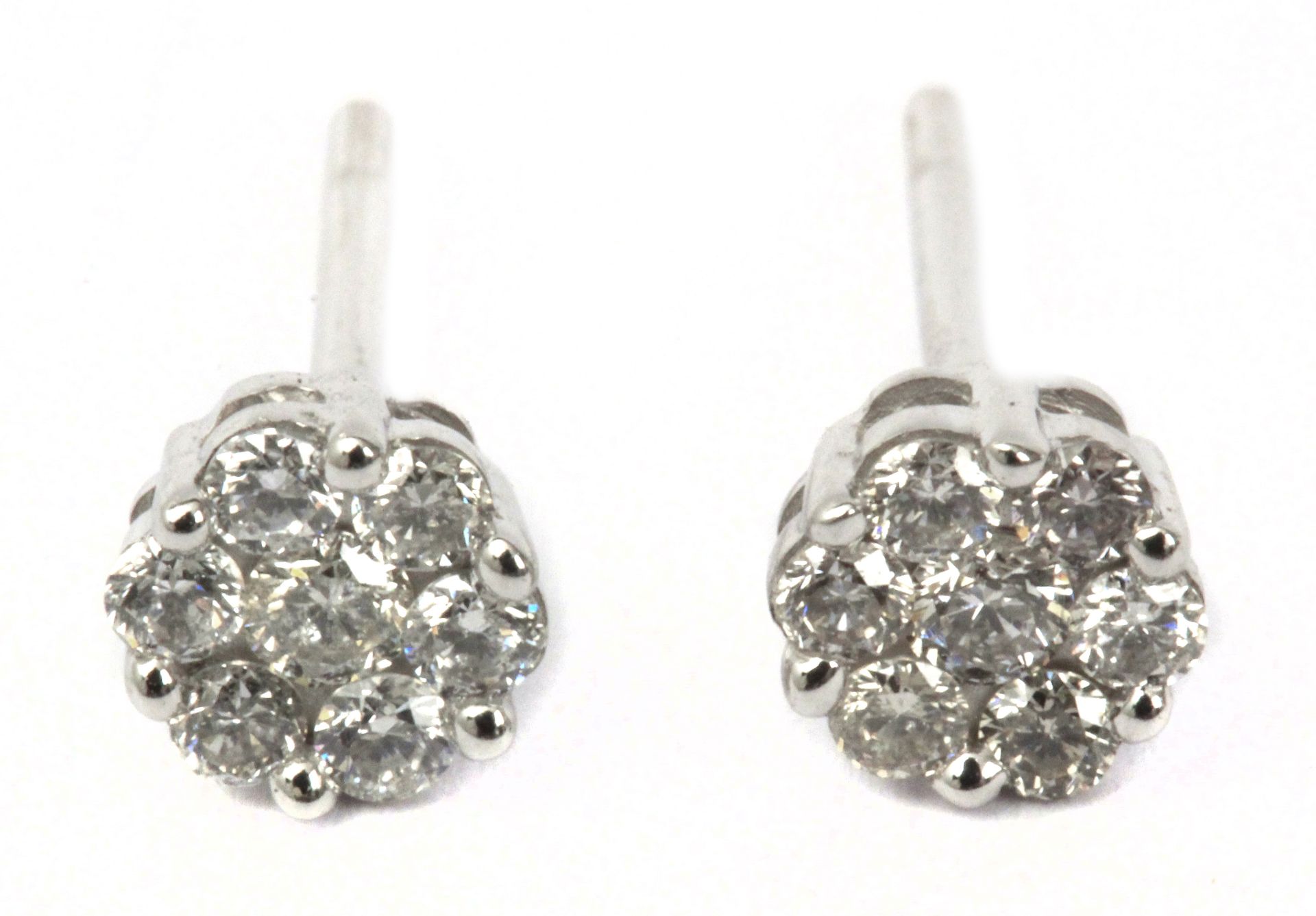 A pair of cluster stud earrings in an 18 k. white gold setting and brilliant cut diamonds
