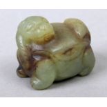 Early 19th century Japanese netsuke in carved jade depicting a Shishi