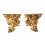 A pair of 17th century carved and gilt wood brackets