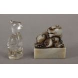 A 20th century Chinese figure of a phoenix in carved rock crystal and a hard stone stamp