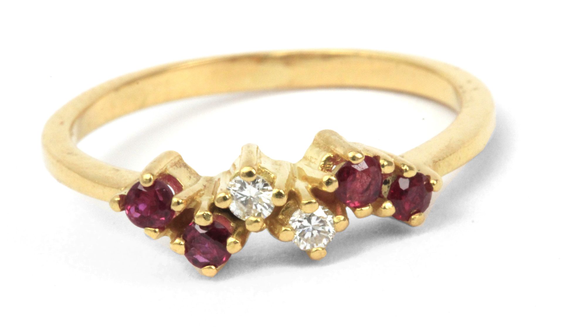 A diamonds and ruby ring with a yellow gold setting