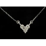 A diamond heart shaped pendant in an 18k. white gold setting