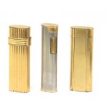 Cartier, Dior & Dunhill. Three gold plated and silver plated lighters