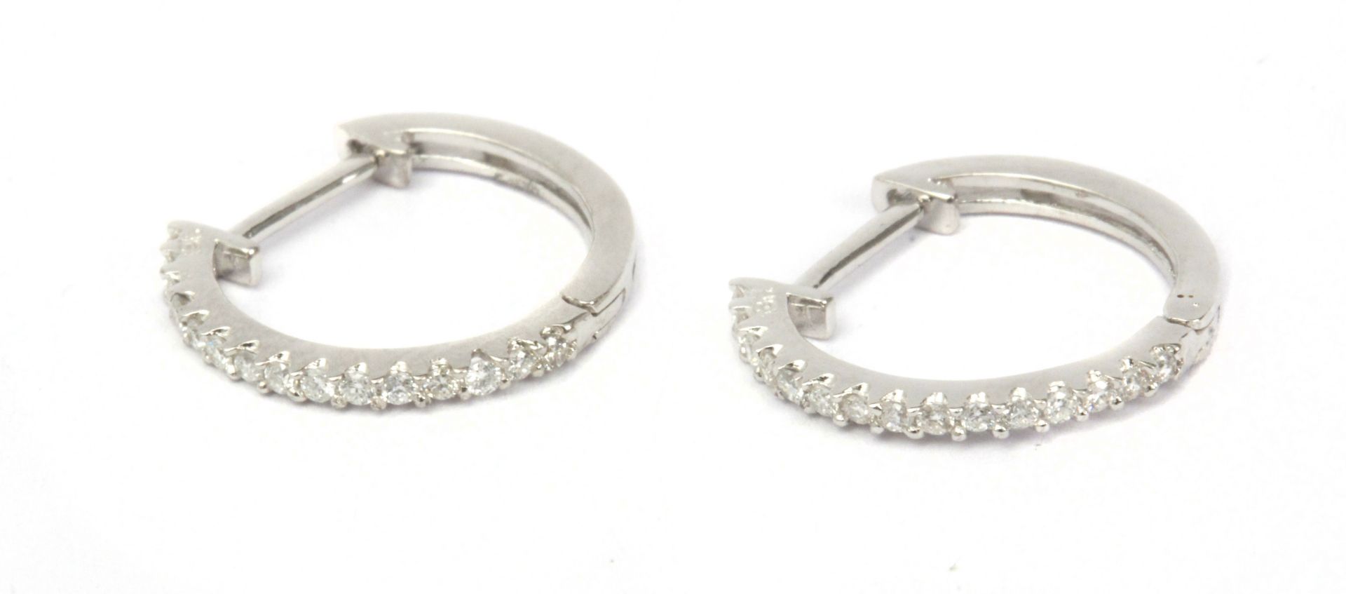 A pair of diamond hoop earrings with an 18k. white gold earrings